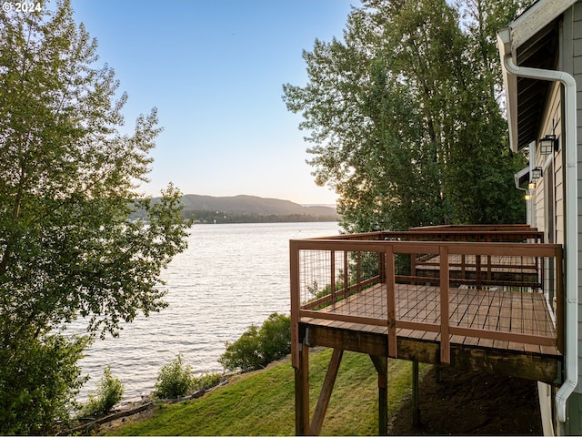 dock area with a water and mountain view