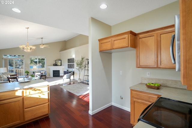 kitchen with black range with electric cooktop, dark hardwood / wood-style flooring, decorative light fixtures, lofted ceiling, and ceiling fan with notable chandelier