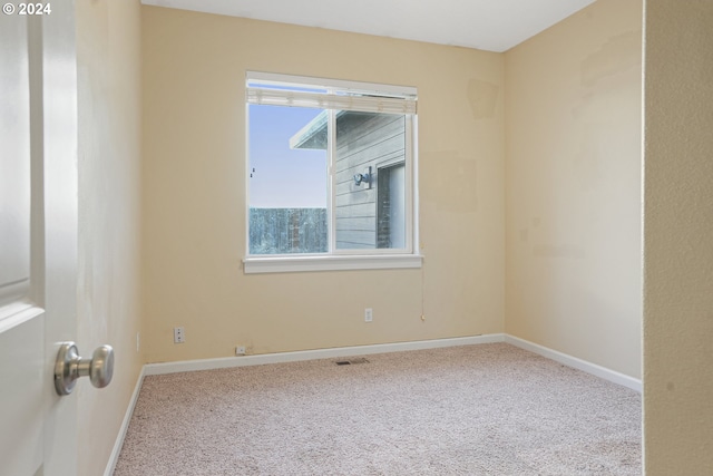 empty room featuring light colored carpet