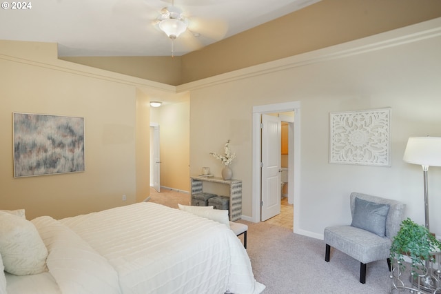 bedroom with light colored carpet, vaulted ceiling, and ceiling fan