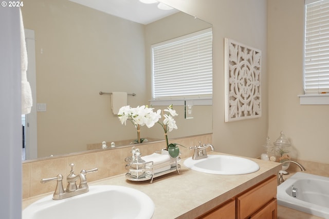 bathroom featuring a bathing tub and vanity