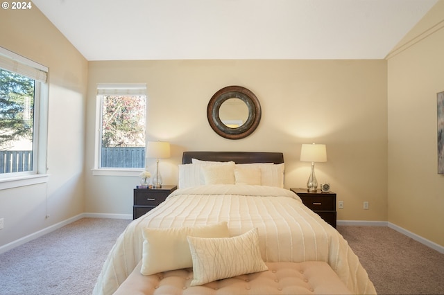 carpeted bedroom featuring vaulted ceiling