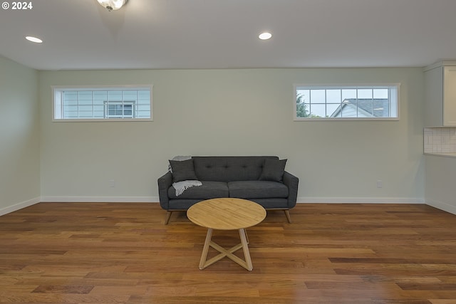 living area with hardwood / wood-style flooring