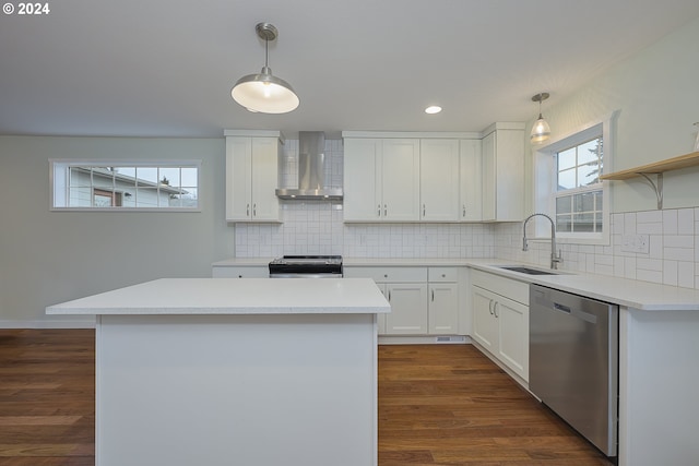 kitchen featuring wall chimney exhaust hood, hanging light fixtures, stainless steel appliances, dark hardwood / wood-style floors, and white cabinets