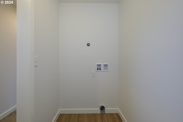 laundry area with hookup for an electric dryer, hookup for a washing machine, and wood-type flooring