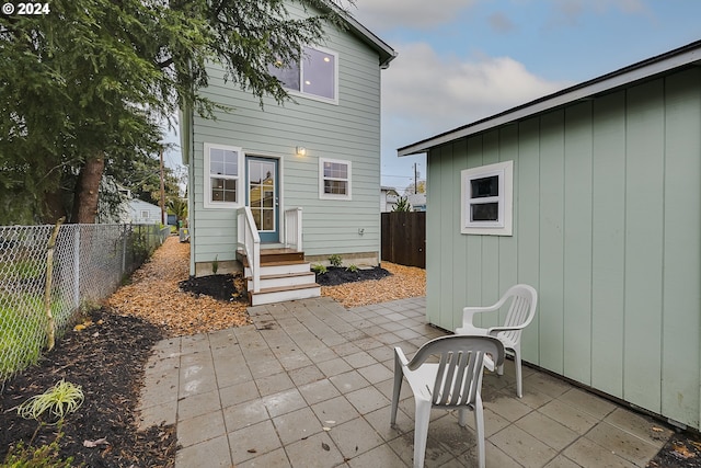 rear view of property featuring a patio