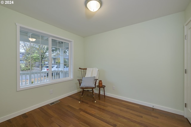 living area with dark hardwood / wood-style floors