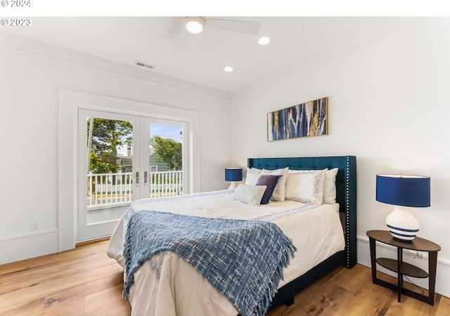 bedroom with french doors, crown molding, light hardwood / wood-style flooring, and access to outside