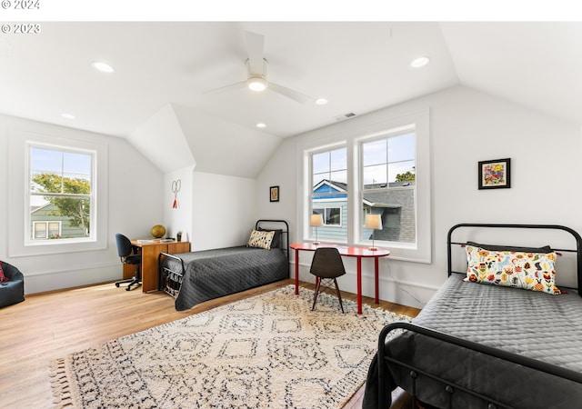 bedroom with hardwood / wood-style flooring, ceiling fan, and vaulted ceiling