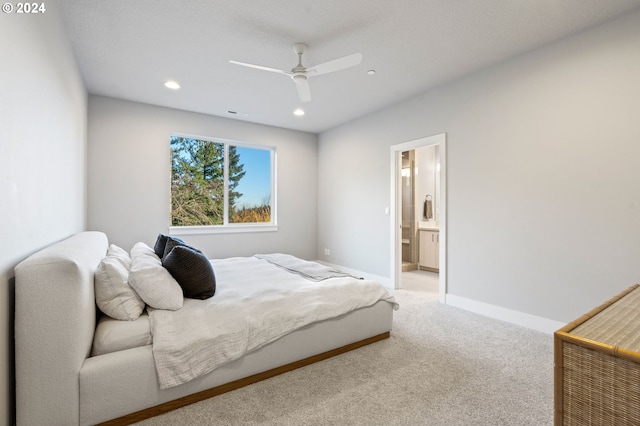 bedroom featuring carpet flooring, ceiling fan, and ensuite bathroom