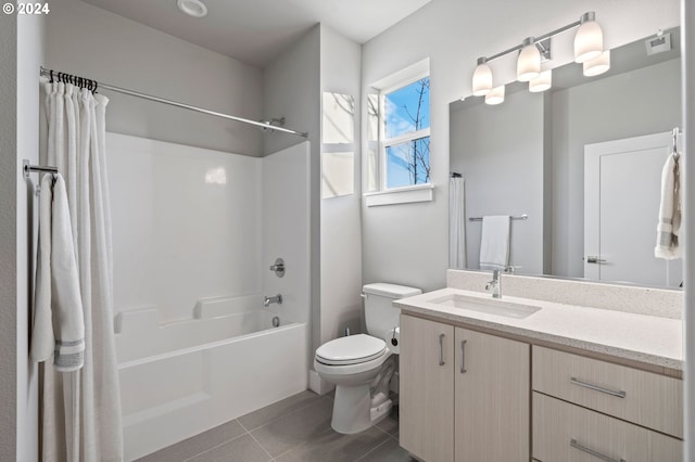 full bathroom featuring tile patterned flooring, vanity, shower / bath combo, and toilet