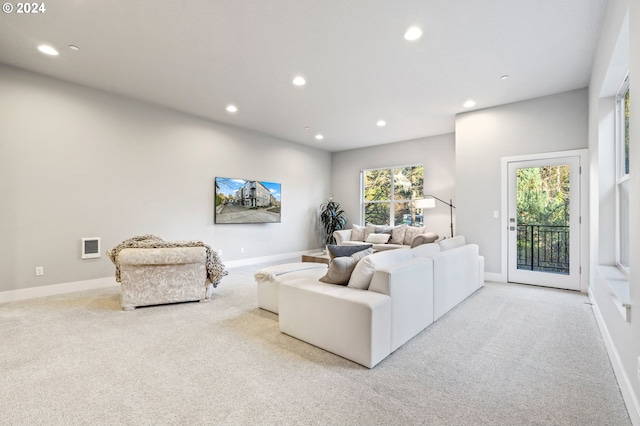 living room with a wealth of natural light and light carpet