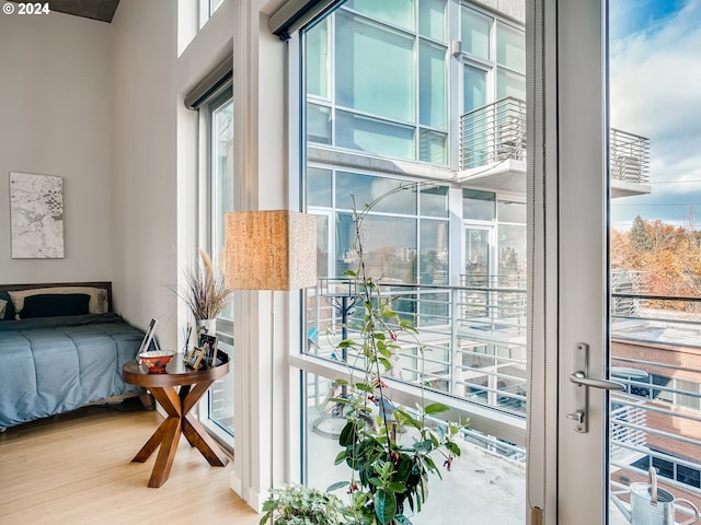 bedroom featuring wood-type flooring and multiple windows