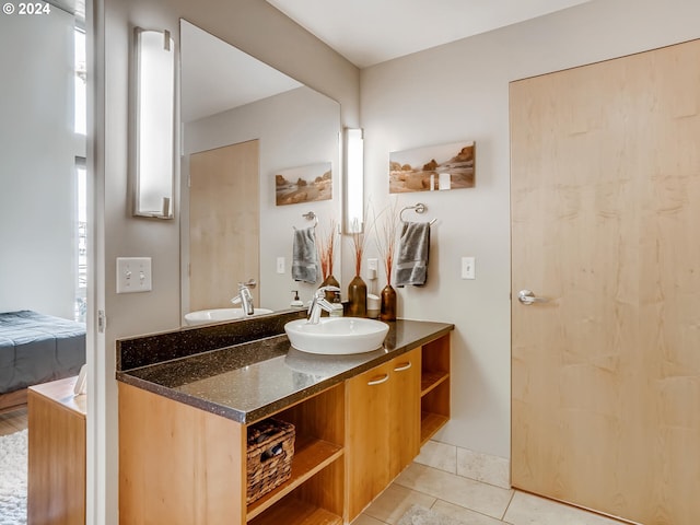 bathroom with tile patterned flooring and vanity