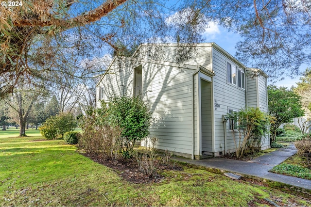 view of home's exterior featuring a yard