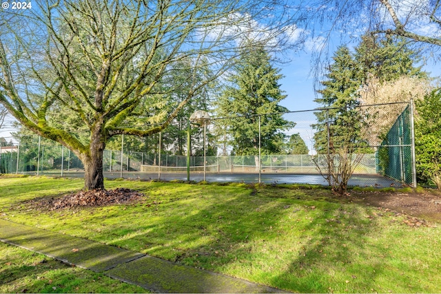 view of yard featuring tennis court