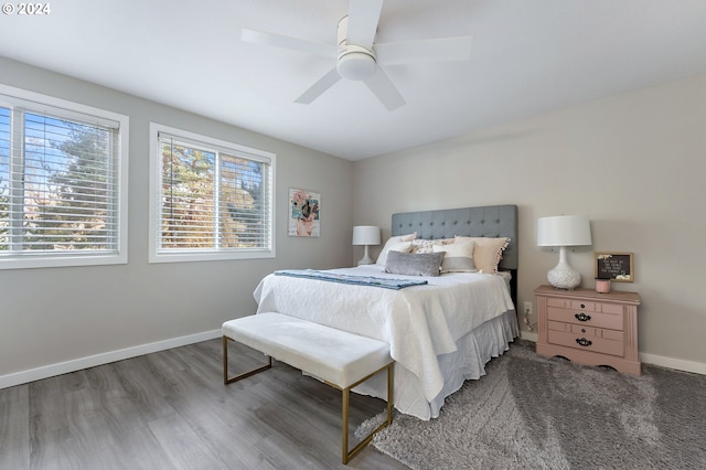 bedroom with ceiling fan and wood-type flooring