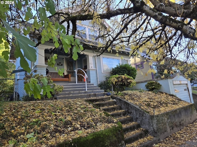 view of front facade with an outdoor structure and a garage