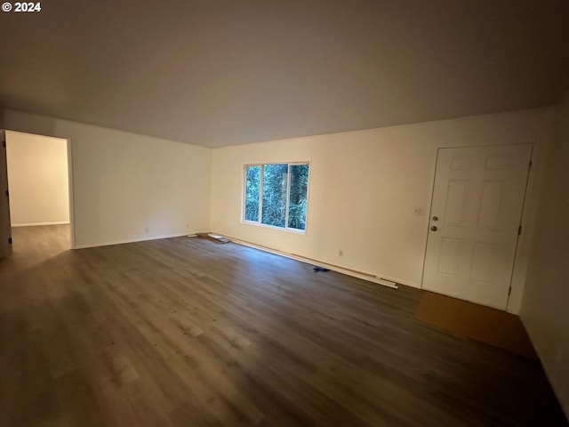 unfurnished living room featuring dark hardwood / wood-style flooring