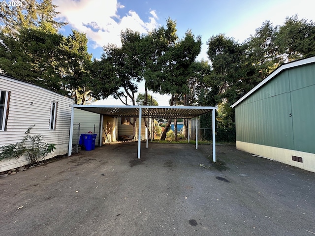 view of vehicle parking with a carport