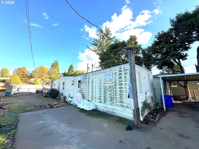 exterior space featuring a carport