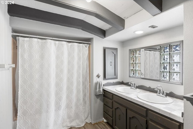 bathroom featuring hardwood / wood-style floors and vanity