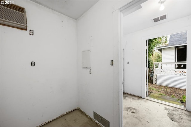 laundry area with a wall mounted air conditioner