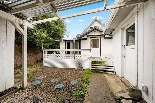 exterior space with a pergola and a deck