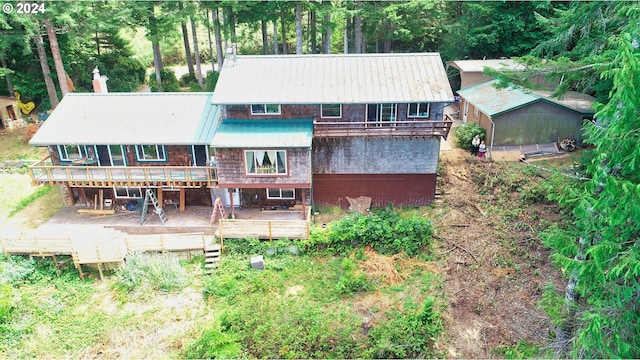 back of house featuring a deck