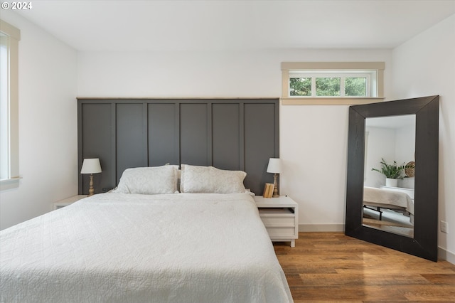 bedroom with hardwood / wood-style floors