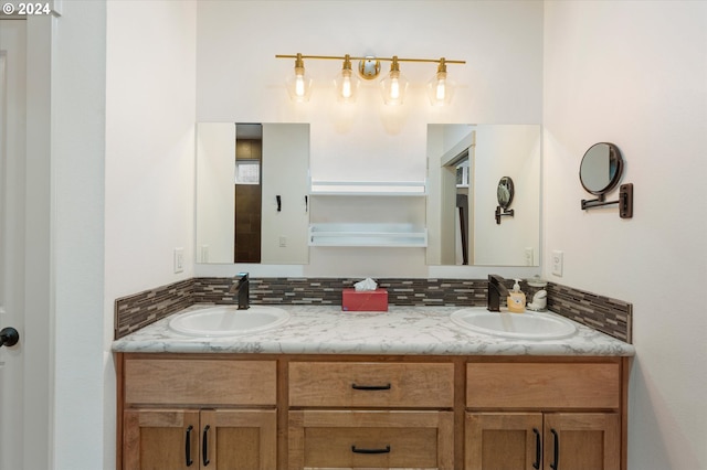 bathroom with vanity and decorative backsplash