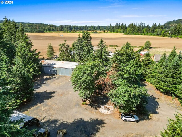 birds eye view of property with a rural view