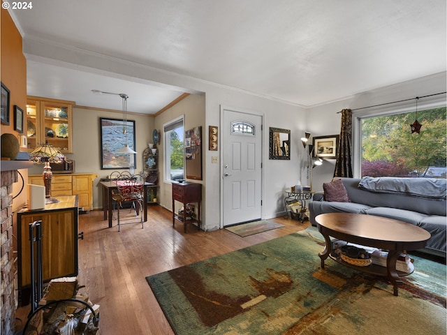 living room featuring ornamental molding and hardwood / wood-style floors