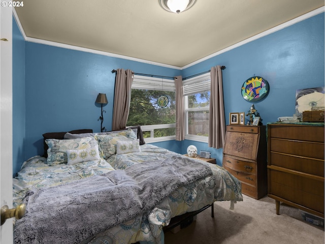 carpeted bedroom featuring crown molding