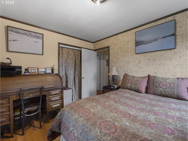 bedroom featuring crown molding and hardwood / wood-style floors