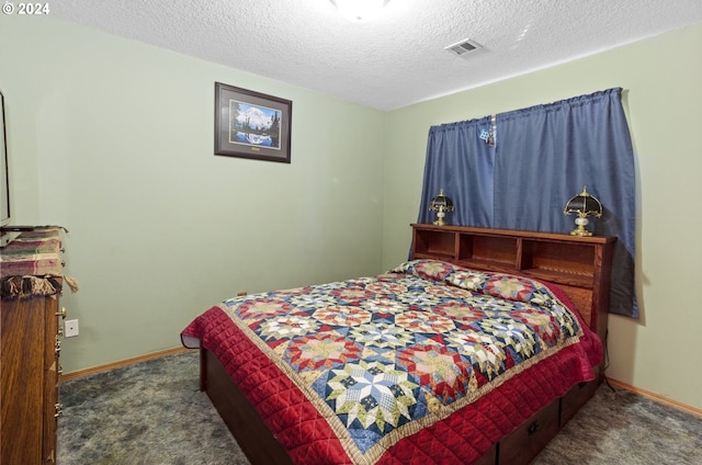 carpeted bedroom featuring a textured ceiling