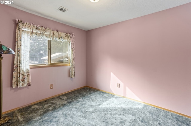 empty room featuring carpet floors