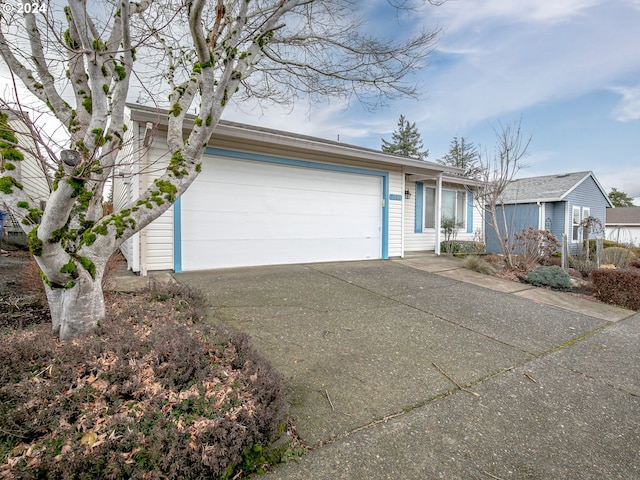 single story home featuring a garage