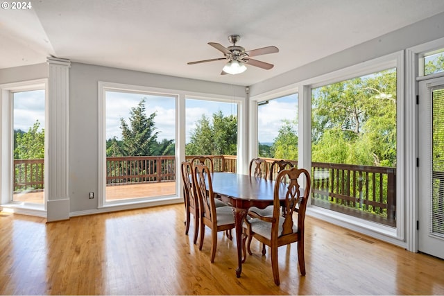 sunroom / solarium with ceiling fan and plenty of natural light