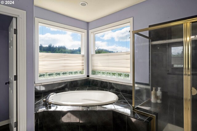 bathroom with a wealth of natural light and plus walk in shower