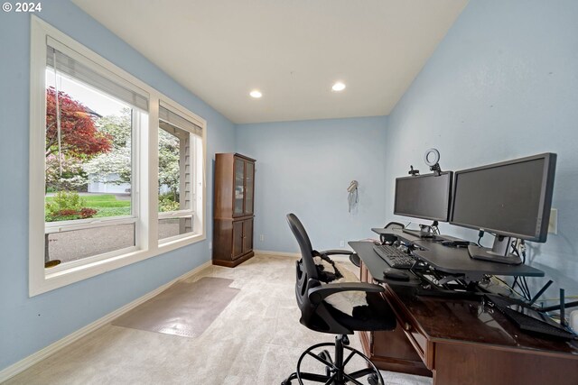 office area featuring light carpet