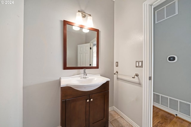 bathroom featuring vanity and wood-type flooring