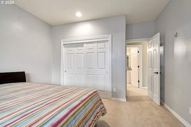 carpeted bedroom featuring a closet