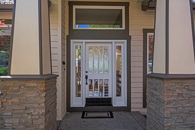 entrance to property with stone siding