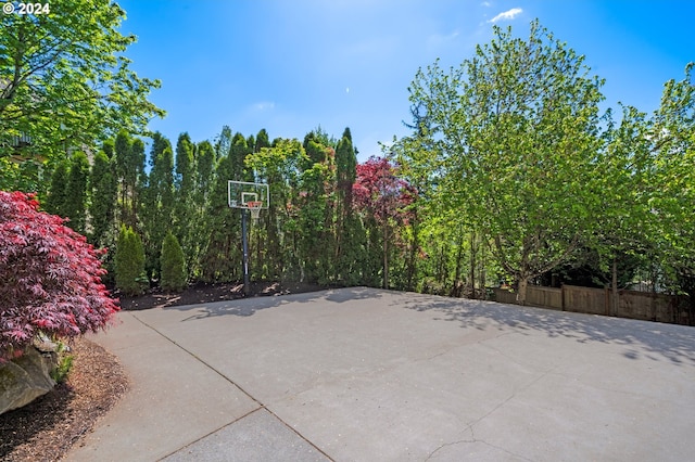 view of patio featuring basketball hoop