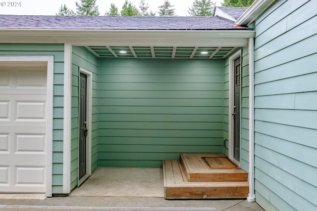 property entrance with a garage