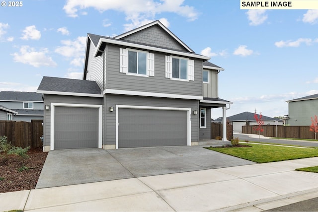 1376 NE Josephine Ct Unit 184, Estacada, OR 97023 - view of front of home featuring fence, concrete driveway, and a garage