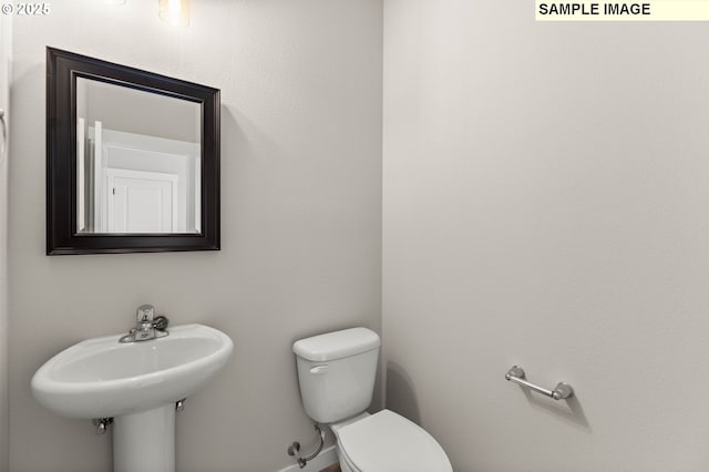 1376 NE Josephine Ct Unit 184, Estacada, OR 97023 - half bath featuring a sink, toilet, and baseboards