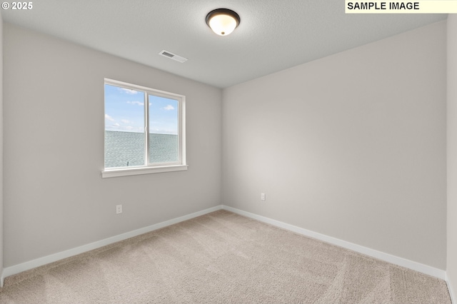 1376 NE Josephine Ct Unit 184, Estacada, OR 97023 - carpeted spare room with visible vents and baseboards