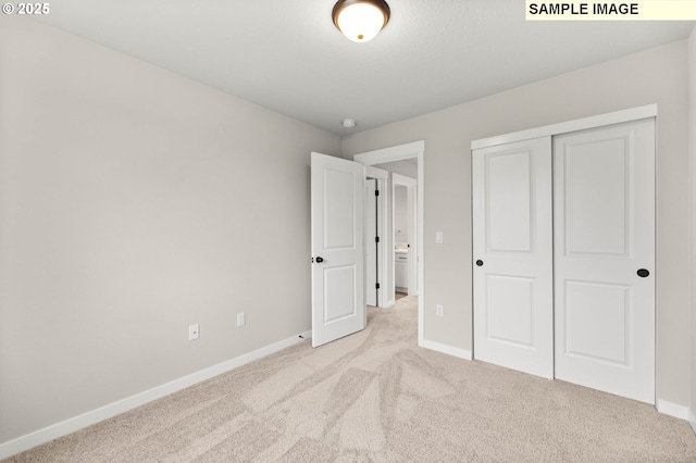1376 NE Josephine Ct Unit 184, Estacada, OR 97023 - unfurnished bedroom featuring a closet, carpet floors, and baseboards